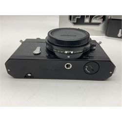 Nikkormat FT2 camera body, serial no. 5066813, in original packaging, together with Nikkormat EL camera body, serial no. 5577358, with Nikon Nikkor 50mm 1:1.8' lens no. 2143575, Nikkormat FT, serial no. 3968385, and Nikomat FT camera body, serial no. 4015491