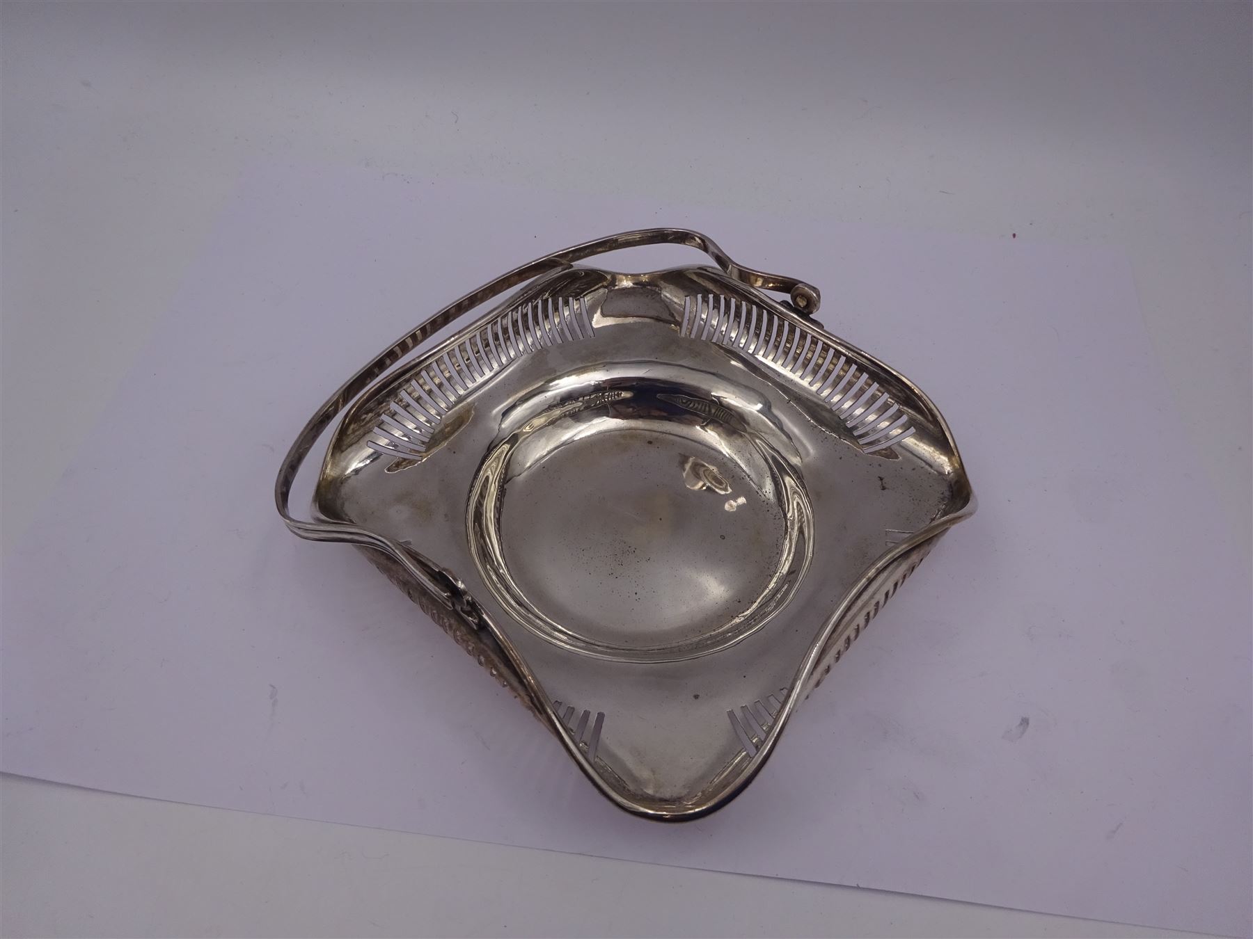 Early 20th century Chinese export silver swing handled basket, of square form with rounded corners and curled, pierced rim, stamped SF 90 with character marks beneath, maker probably Sing Fat, W12.5cm, including handle H11cm