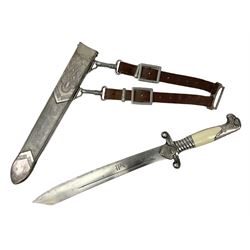 German Reichsarbeitdienst RAD Leader's Hewer dagger, the 26cm single edged scimitar shaped blade with narrow fuller, etched Arbeit adelt; by E.D. Wusthof, Solingen; the aluminium hilt with spade and wheat ear langet; two piece white plastic grip and eagle head pommel; pebbled steel scabbard engraved with ears of wheat and strapwork with double leather hangers L40cm overall