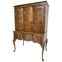 Early to mid-20th century figured walnut chest on stand, four graduating drawers on stand fitted with single drawer, drop handles in the form of shields with three recumbent lions, on cabriole supports
