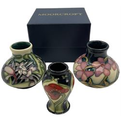 Three miniature Moorcroft vases, one decorated in the Summer Rosette pattern, circa 2011, H6cm, one decorated in Lord of Leith Downs, circa 2008 H6cm and the third decorated in Isis, H6cm 