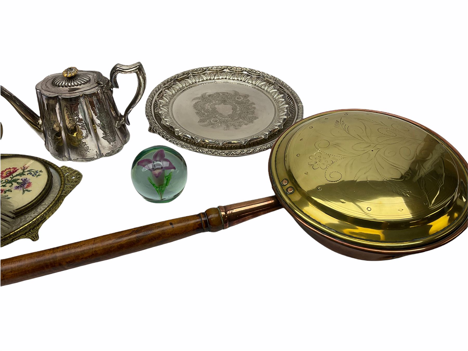 ladies vanity set with floral embroidery backs, comprising mirror, two brushes, comb and tray, along with paperweight with internal floral design, brass and copper bedwarmer, two metal serving trays, a metal teapot and a globe. 