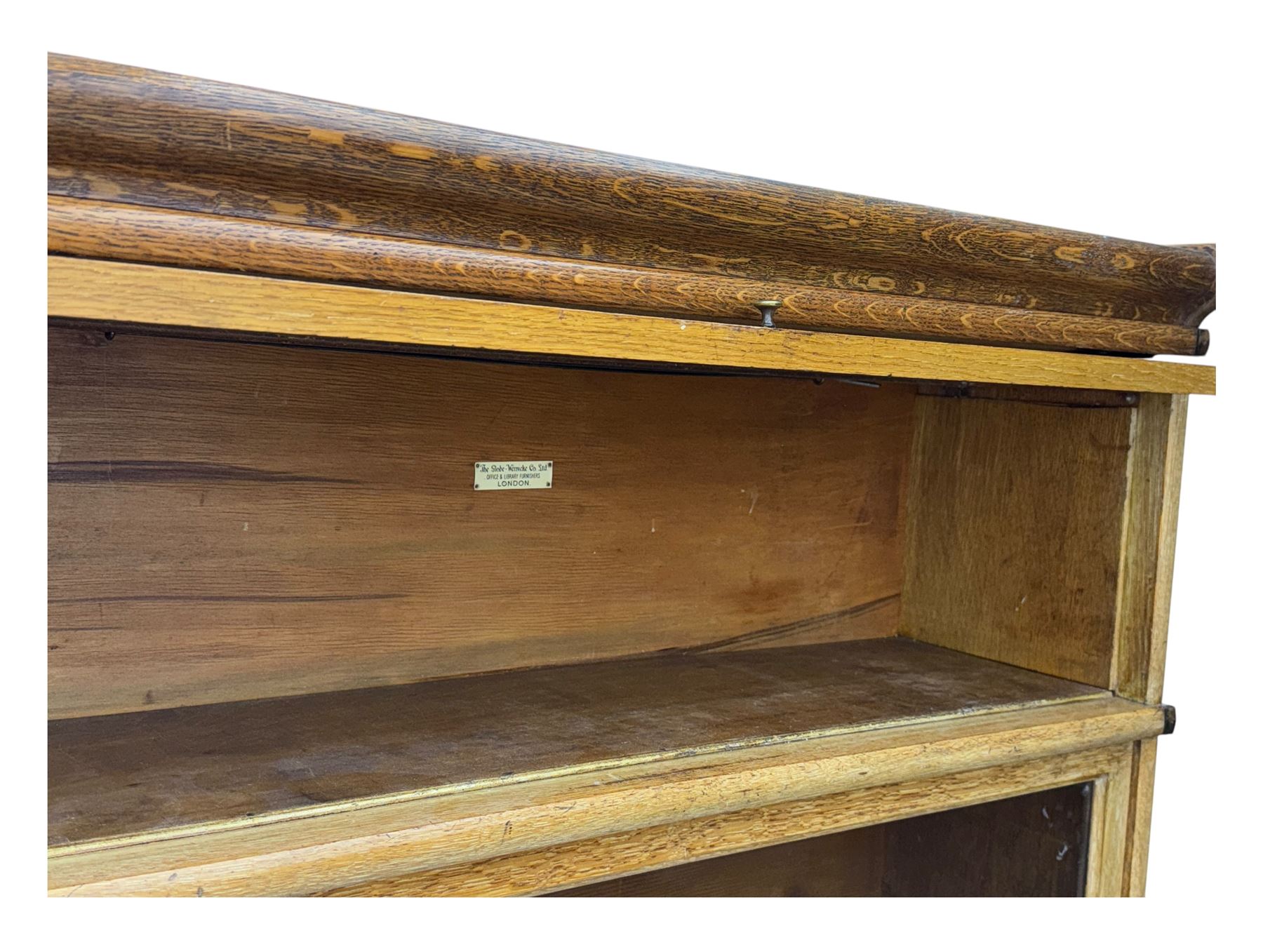 The Globe Wernicke Co. Ltd. - early 20th century oak five-tier stacking library bookcase, each section enclosed by hinged and sliding glazed door, on shaped plinth base 