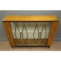  Mid 20th century display cabinet enclosed by sliding glass door with black and gold lozenge transfers, tapering supports, W113cm, H92cm, D30cm  