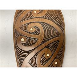 Maori hardwood Patu club, carved and detailed with bone inlay, 42cm