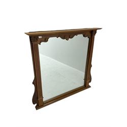 Carved and stained beech overmantle mirror with projecting cornice above square plate, flanked by fluted corinthian column pilasters, with foliage scrolled brackets