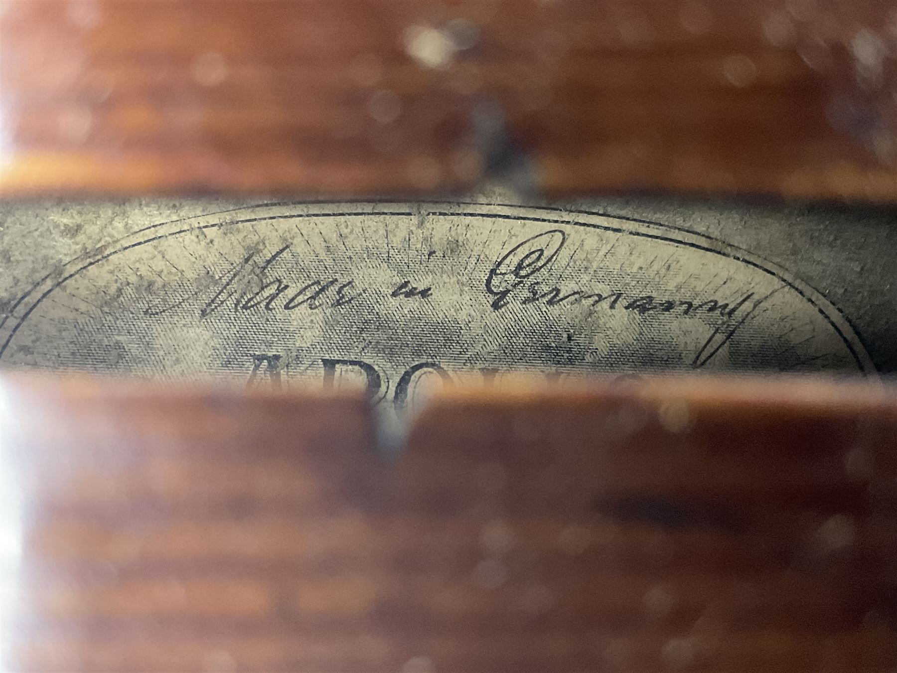 German trade violin c1900 with 35.5cm two-piece maple back and spruce top; bears label 'Made in Germany Apollo Class 6 No.2132' L59cm; in carrying case with two bows