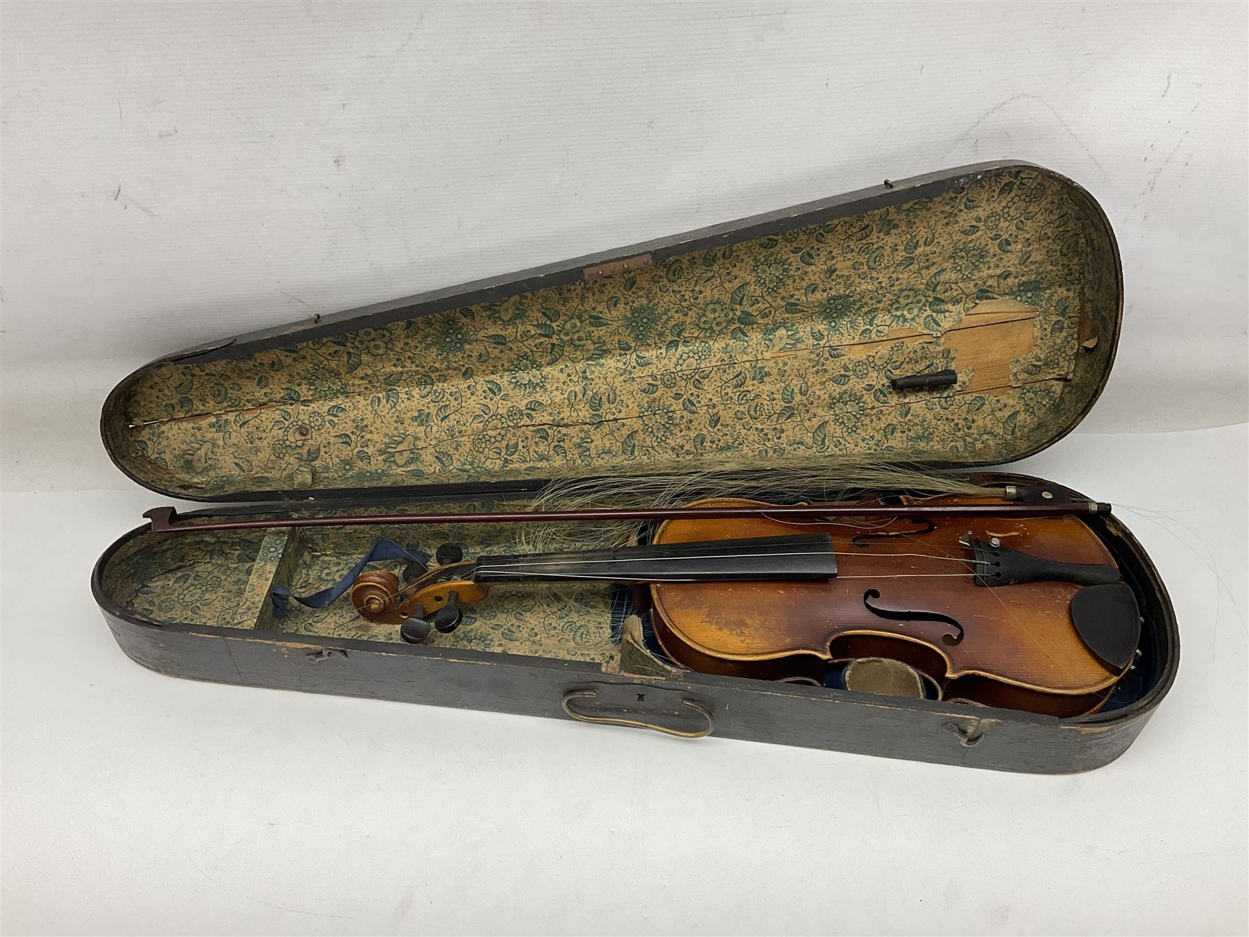 Czechoslovakian violin c1920 with 36cm two-piece maple back and ribs and spruce top, bears label 'Copy of Antonius Stradivarius Made in Czechoslovakia' L59cm; in carrying case; 1950s Czechoslovakian violin; and 195os Czechoslovakian three-quarter size violin; both cased (3)