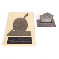 Late 20th century cast iron Firemen's Insurance Company fire mark plaque, D33cm, together with replica Phoenix Assurance Company Limited fire mark, upon plaque, modern Royal exchange Assurance company crest upon shield, Phoenix Assurance Company Limited commemorative dish, pewter inkwell, and pewter desk stand, L17cm, and a modern York & North of England cast brass heraldic plaque, H22cm