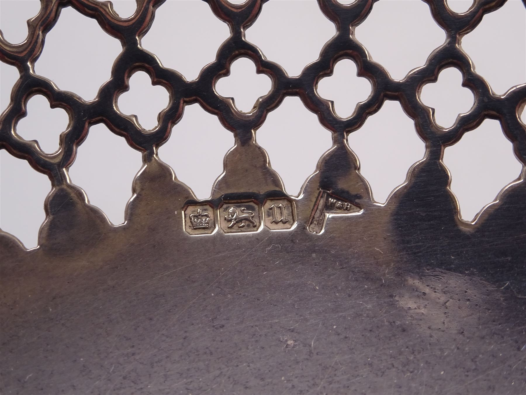 Early 20th century silver pedestal bon bon dish, of circular form, with pierced quatrefoil lattice work design sides and shaped rim, upon circular spreading beaded foot and knopped stem, H10.6cm, hallmarked Walker & Hall, Sheffield 1912