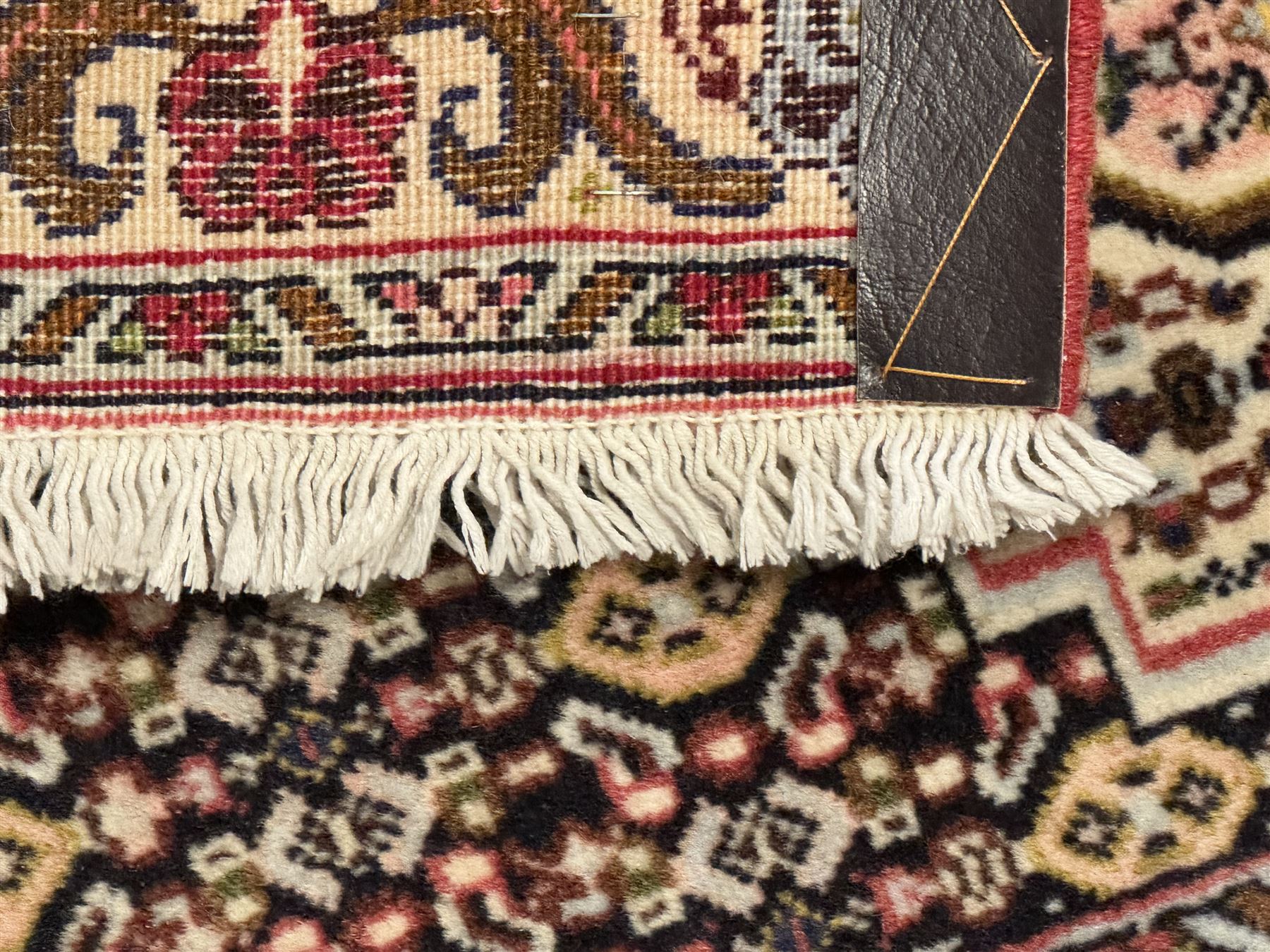 Small Persian Bidjar rug, the field decorated with floral Herati motifs, within floral design borders and guard stipes 