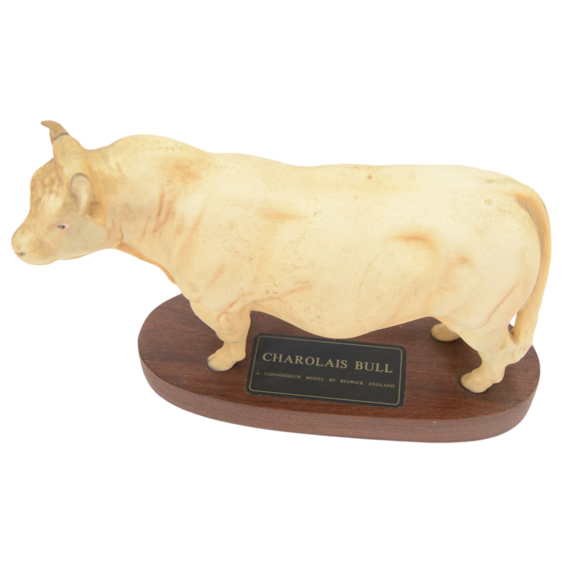 Three Beswick Connoisseur Cattle: Hereford Cow and Calf, Charolais Cow and Calf and Charolais Bull, all on wooden plinths, H20cm