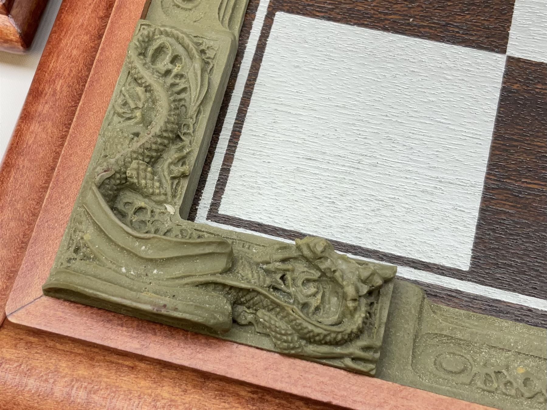 Danbury Mint 'The Fantasy of the Crystal' chess set consisting of mythical pewter chess pieces within a wooden case with chess board lid, together with 16 additional chess pieces in a wooden display case.