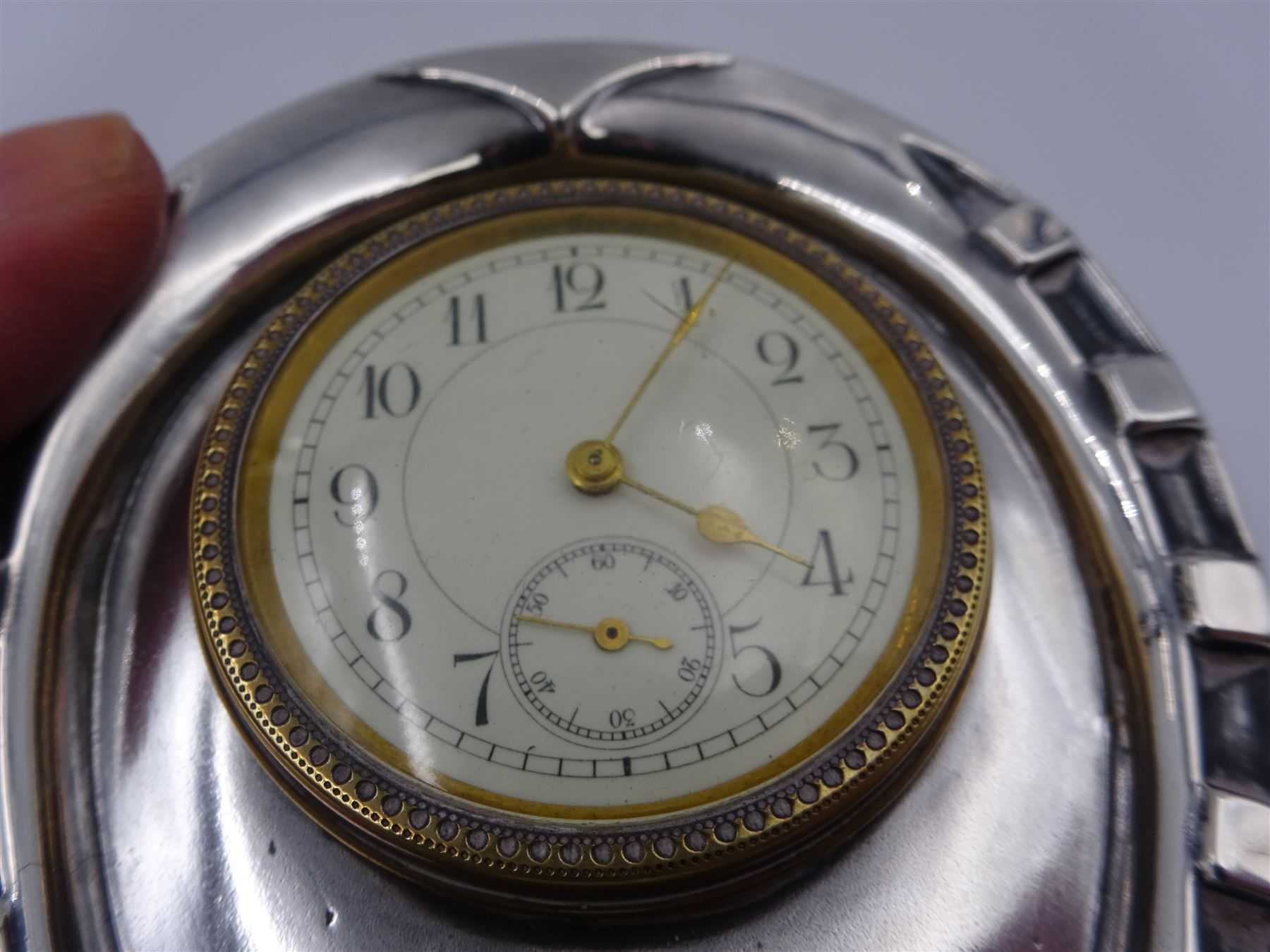 Victorian silver mounted desk clock, in the form of a horseshoe, the dial within a gilt border, with subsidiary second dial, hallmarked Douglas Clock Co, Birmingham 1897, H8.5cm
