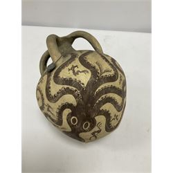 Reproduction Ancient Greek vessel in the style of Crete Minoan period, decorated with marine style ocotopi, with three handles and spout, signed beneath, H20cm