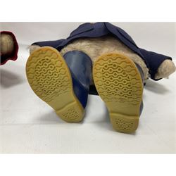 Pair of Paddington Bear teddies with amber eyes, the first example having a brown felt hat, red coat and blue PB boots with original label; the second having a grey felt hat, blue coat and blue Dunlop boots, tallest H51cm 