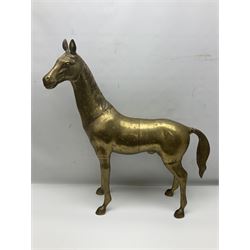 Pair of large brass horse figures, the first modelled as a standing horse, the second as a horse bending to graze, tallest H27cm