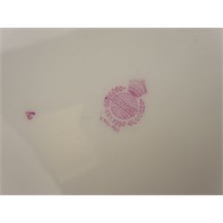 19th century Minton tea set, comprising twelve teacups, eleven saucers, fifteen side plates, cream jug, slop bowl, and two cake plates, decorated with panels of floral sprays, upon a green ground, heightened with gilt throughout, with printed puce mark beneath, and pattern number 5329
