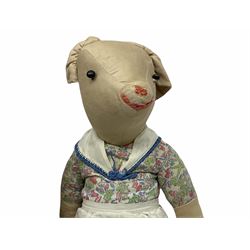 1950's teddy bear with jointed limbs, revolving head, wood filled body, stitched nose and mouth, applied glass eyes and foot pads, together with a quantity of handmade soft toy rabbits and penguins. 