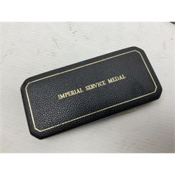 Two Imperial Service Medals to Elsie Hannah Ferguson and Fred Whitehead; each in original case; WWI Special Constabulary Medal to Inspr. Alfred W. Thompson; modern Prisoner of War Medal; cased; replica Victoria Cross and India Mutiny Medals with archive of information relating to Pte. Robert Newell V.C. 9th Lancers; replica Victoria Cross and George Cross with miniatures; and other replica medals etc