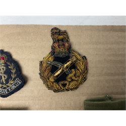 Quantity of WW1 and later RAMC and RSM cloth and metal badges and insignia