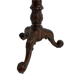Chippendale design mahogany wine or urn table, square top with raised fretwork gallery over a gadrooned lower edge, fitted with pull-out slide, raised on turned and foliate carved vasiform pedestal with tripod base