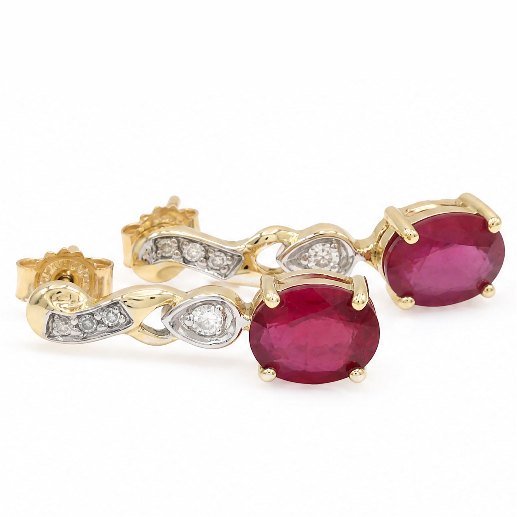 9ct gold ruby and white topaz pendant earrings, each stud set four round cut topaz's, suspending an oval cut ruby, Birmingham 2006
