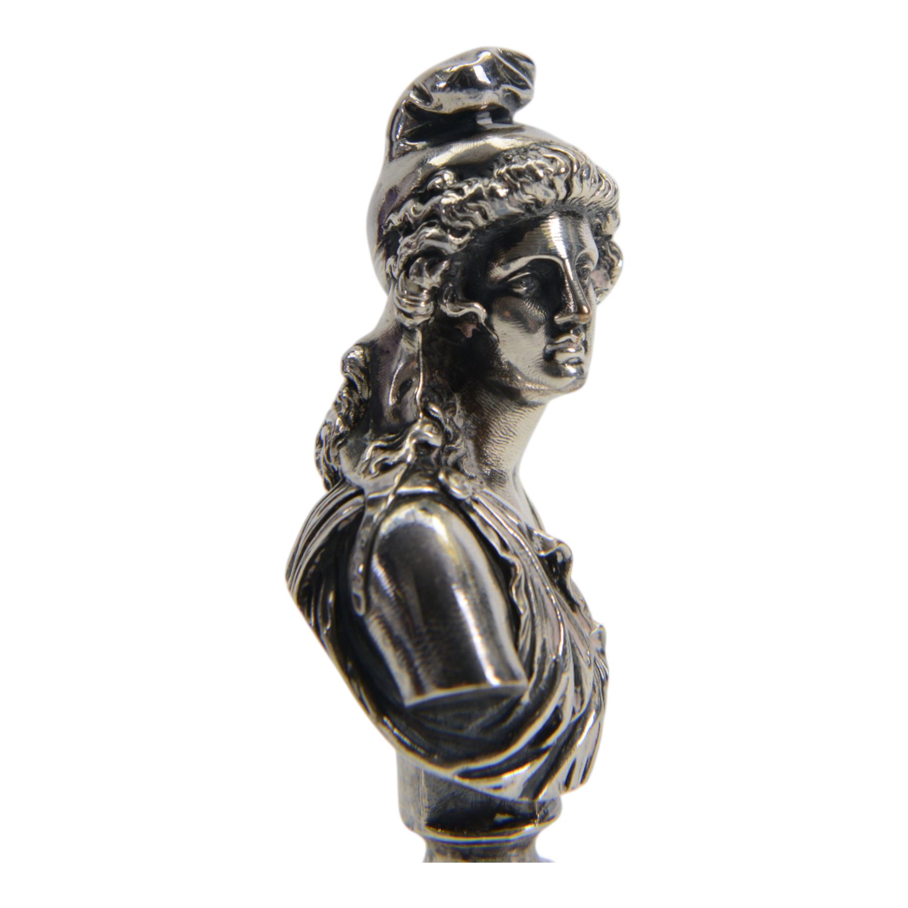 19th century French silver plated seal, modelled as a bust of Attis, Consort of Cybele after Jean Baptiste Clesinger, cast by the Marnyhac foundry, the bloodstone stamp with crest and Latin motto 'Festina Lente' (make haste slowly), H10cm, contained within original maker's fitted brown leather box with purple silk and velvet lined interior detailed 'MARNYHAC 1 RUE DE LA PAIX' 

Provenance: From the collection of Andrew Chichester Everitt.