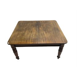 Late 19th century extending mahogany dining table, square top with banded frieze rail, raised on turned octagonal supports with  brass cups and castors, with two additional leaves