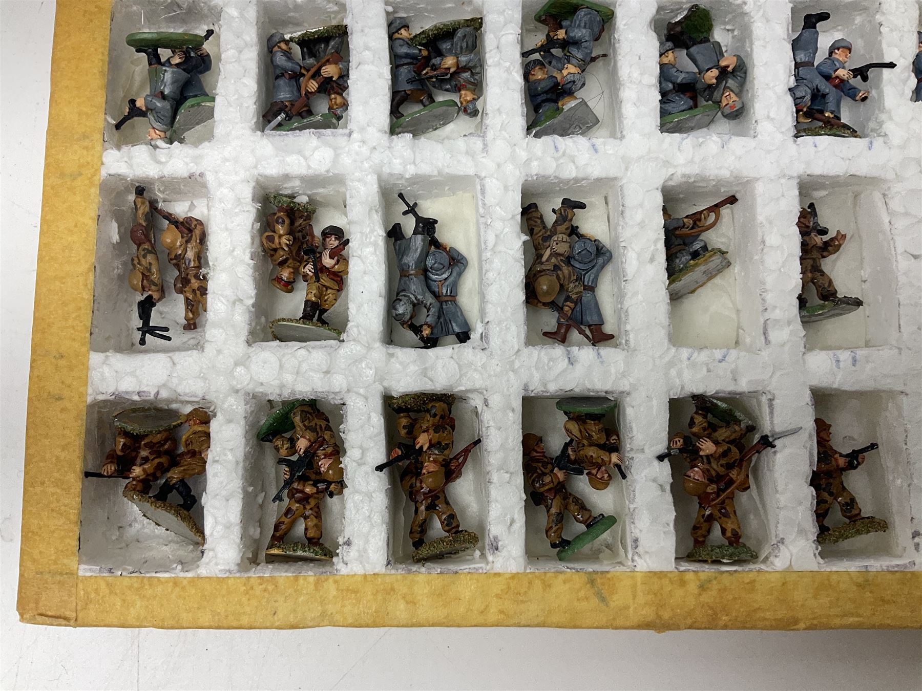 Lamming Miniatures - Bill Lammings own 1970s promotional display set of sixty-three 25mm miniature WW2 Russian Infantry soldiers with light artillery gun; hand painted by Bill Lamming for exhibition.