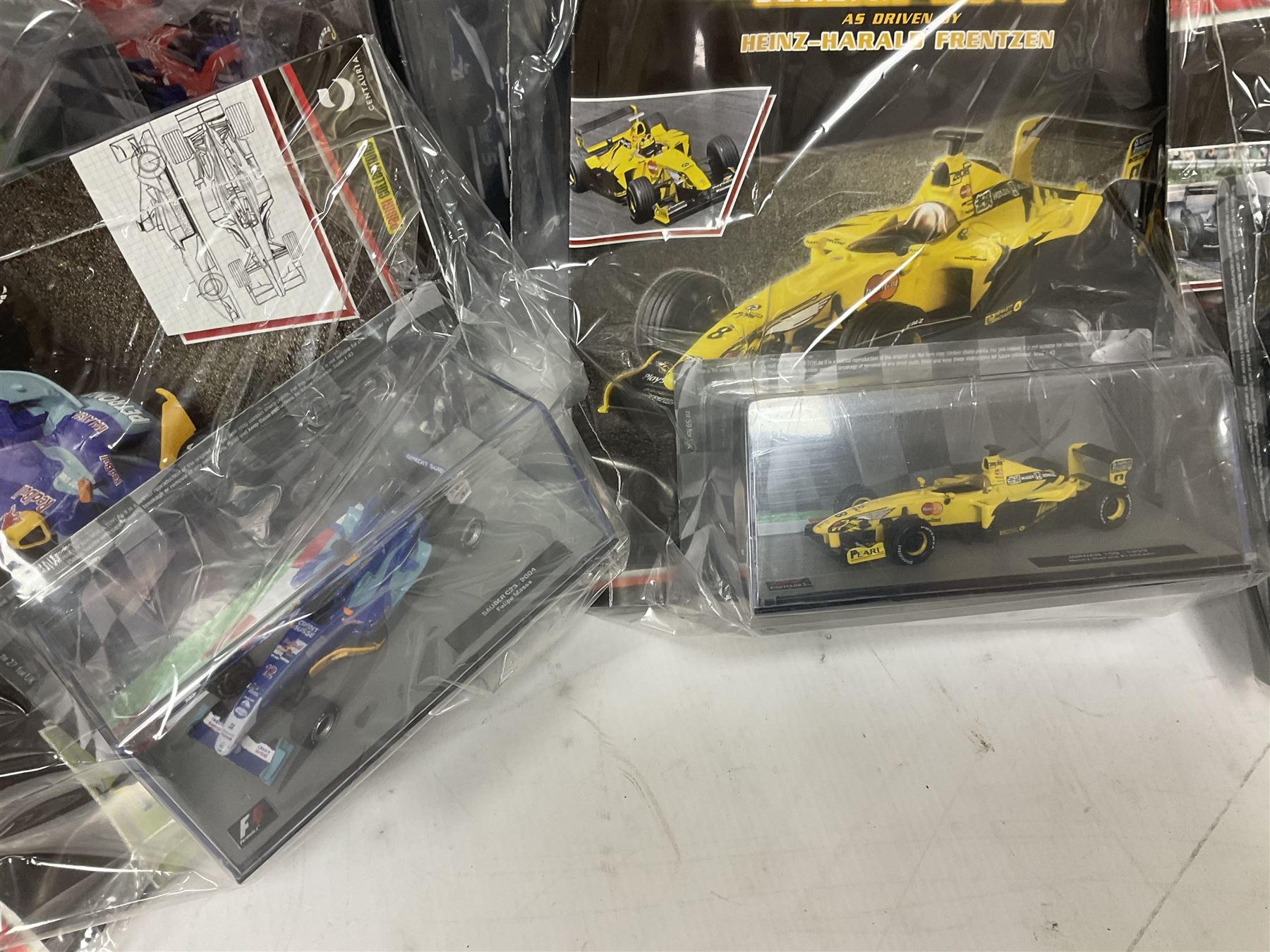 Panini Formula 1 The Car Collection - twelve die-cast models including ten in unopened packaging with periodical; all models in plastic display boxes; and eight other boxed die-cast models of racing cars by Corgi, Onyx, Classico, Minichamps etc (20)