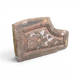 Pair of 19th century hewn and carved stone wall ends, the facias carved as shaped faux fielded panels