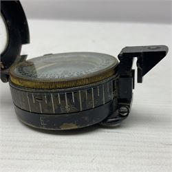 WWII British marching compass, the black lacquered brass case inscribed T.G.Co.Ltd. No.B100228 (broad arrow) 1941 Mk.III; and a ship's brass cased clinometer, the silvered dial marked R(arrow)L, D9cm; in leather carrying case (2)