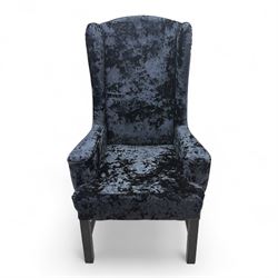 Oka - Pair of contemporary upholstered wingback armchairs, in black and blue textured velvet effect fabric, with tall scroll wing sides and square tapered legs joined by stretchers