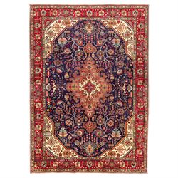 North West Persian carpet, the indigo field centred by a large terracotta and ivory medall...