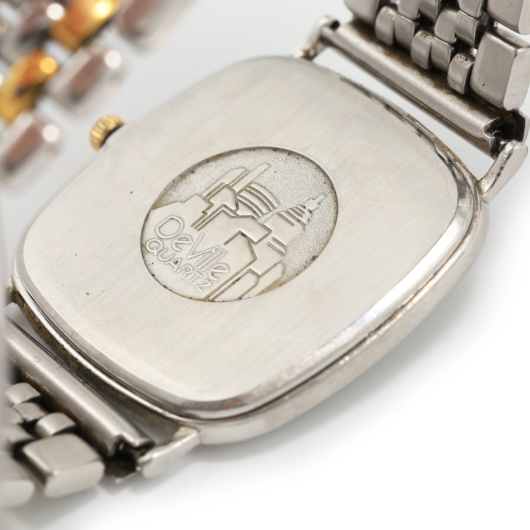 Omega gentleman's stainless steel quartz wristwatch, white dial with Roman numeral hour markers, on stainless steel bracelet and one other gold-plated and stainless steel, Ref. 1378, champagne dial with dot markers