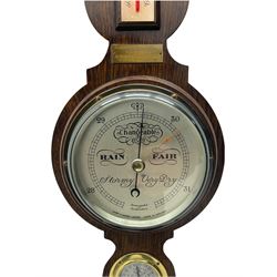 A  20th century Short & Mason compensated aneroid barometer with a  5' silvered dial, measuring barometric pressure from 27 to 32 inches with weather predictions, with a steel indicating hand and brass recording hand within a chrome bezel and flat bevelled glass, with spirit thermometer, Hygrometer and presentation plaque dated 1970. 



