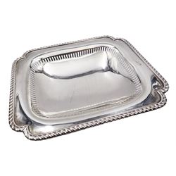 Small 20th century silver footed dish, of rectangular form with shaped corners, pierced sides, and oblique gadrooned rim, upon a short foot with confirming pierced sides, hallmarks worn and indistinct, makers mark probably Cooper Brothers & Sons Ltd, W14.5cm, approximate weight 5.17 ozt (160.9 grams)