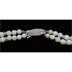 Double strand opal bead and glass bead necklace, graduating opals between 3.5mm to 9mm, on 18ct white gold old cut diamond milgrain set clasp, retailed by Z Barraclough & Sons Ltd, Leeds boxed

Notes: By direct decent from Barraclough family