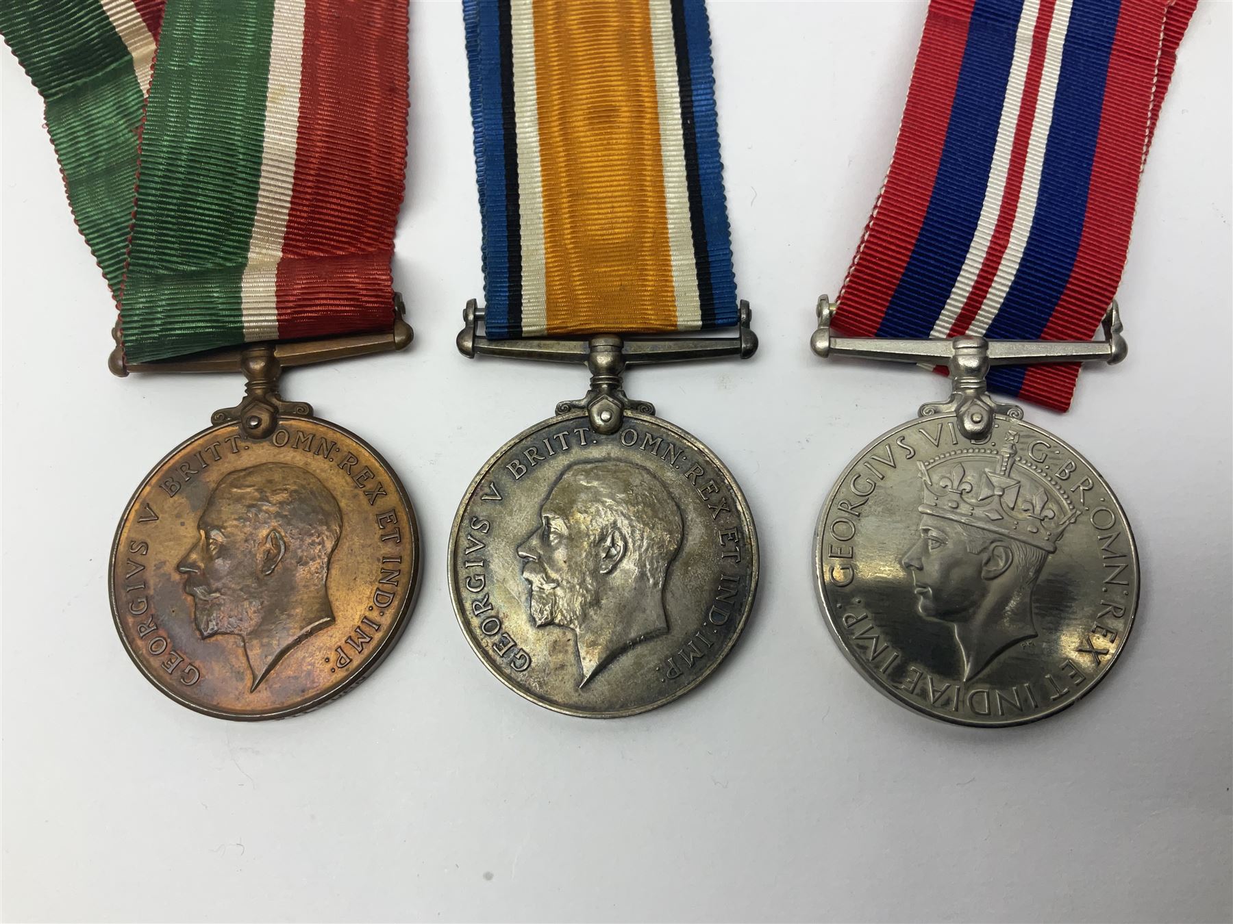 WW1 pair of medals comprising British war medal and Victory Medal awarded to 19774 Pte. G. Headlam Sea. Highrs.; another WW1 pair of medals comprising British War Medal and Mercantile Marine Medal awarded to Charles Filburn; WW2 group of five medals comprising 1939-45 War Medal, Defence Medal, 1939-45 Star, Africa Star and Burma Star; in issue box addressed to Mr. H, Smithson with medal slip; all with ribbons; and Edward VIII Coronation medal (10)