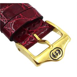 Gucci gold-plated rectangular quartz wristwatch, Ref. 2600M, red and silvered dial, on original red leather strap, boxed
