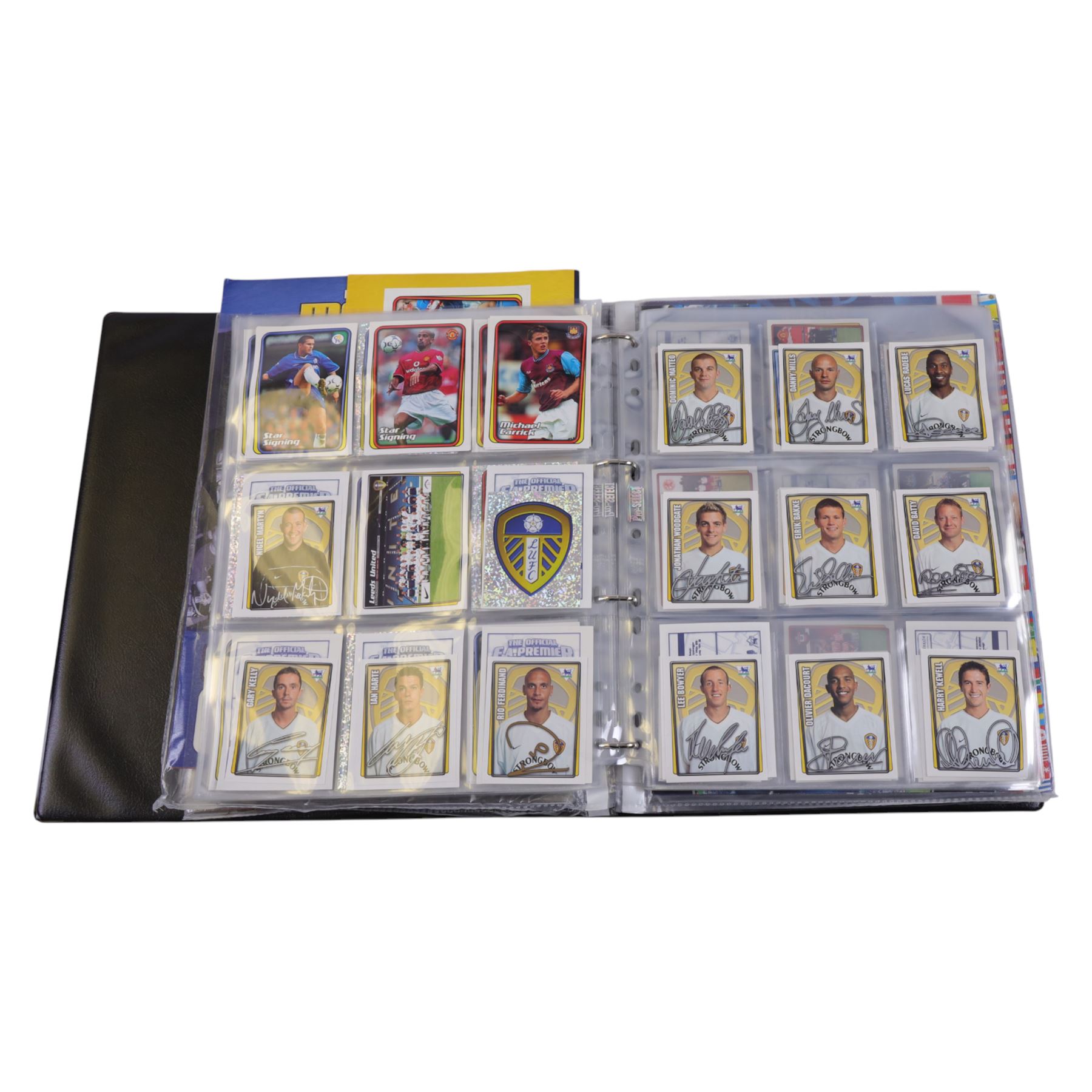 Collection of Football related stickers and albums, including Portugal Euro 2004 unused album and a collection of stickers,  Merlin The Official FA Premier League Sticker Collection 10th Edition 2003 unused album and stickers, Merlin The Official FA Premier League Sticker Collection 11th Edition 2004 unused album, Merlin The Official FA Premier League Sticker Collection 2001 unused album and stickers, Merlin The Official FA Premier League Sticker Collection 2002 unused album and stickers and Merlin's 2002 England unused album and stickers, housed in two folders