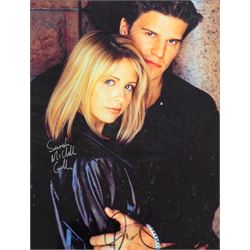 Signed Buffy the Vampire Slayer montage, comprising limited edition print signed by artist Julie Bell to the centre bordered by signed cast photographs to include Sarah Michelle Gellar, Anthony Head, Alyson Hannigan, David Boreanaz, James Marsters and Juliet Landau, in large presentation frame, frame H109cm, W126cm