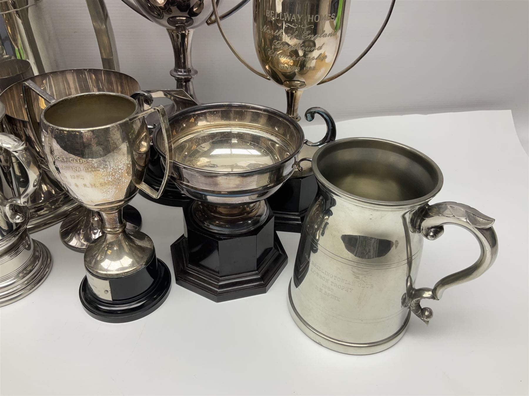 Collection of pewter and silver-plated trophy cups and presentation tankards, largest H28cm
