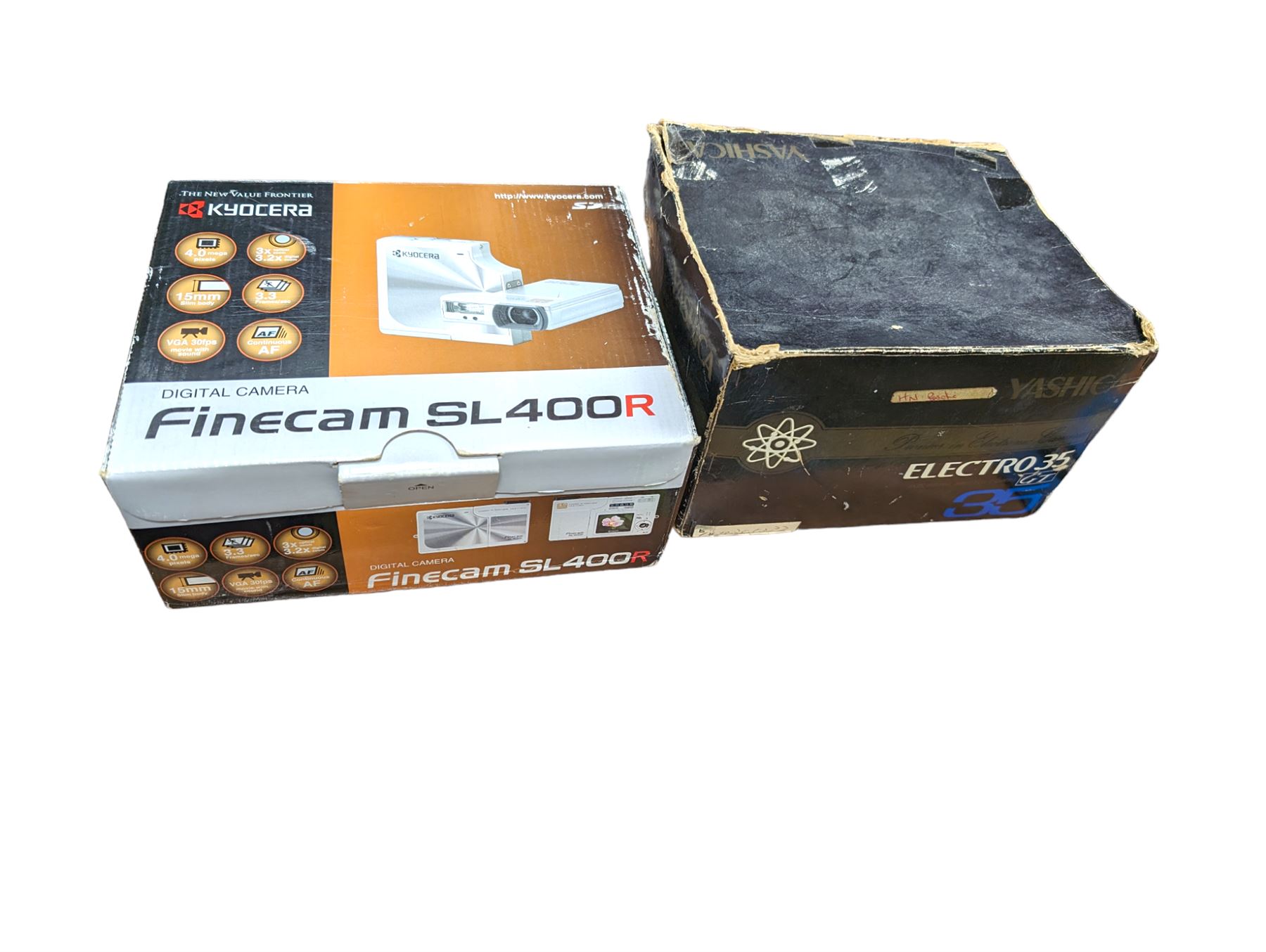 Yashica Electro 35mm film camera and a Kyocera Finecam SL400R, both boxed