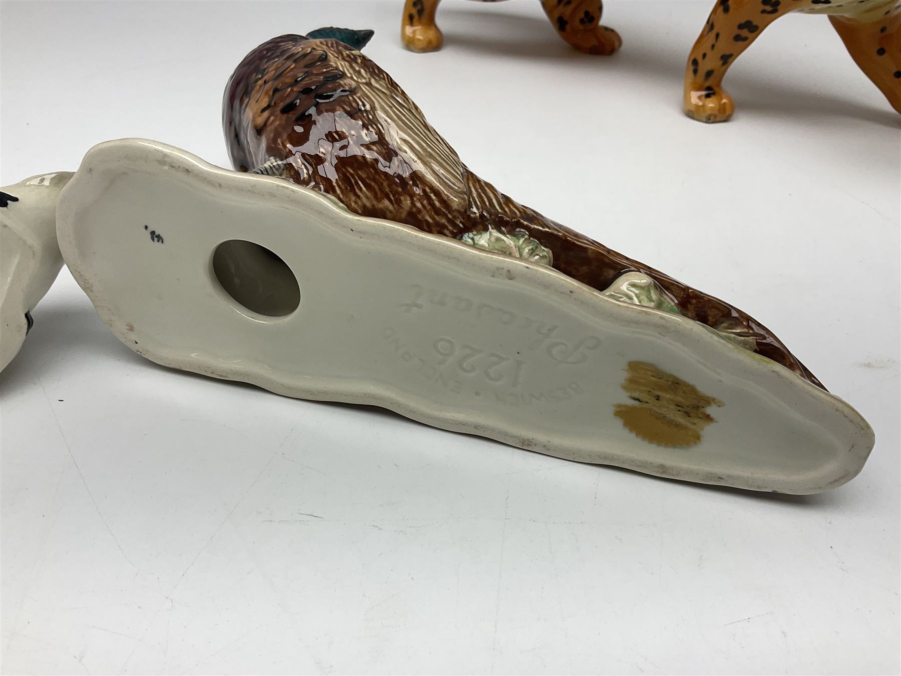 Group of Beswick figures to include leopard no 1082, rabbits, swan, pheasant no 1226 etc, all with marks beneath