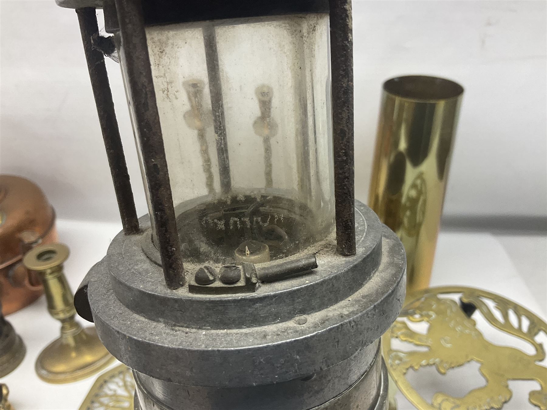 Collection of brassware, to include two jardinieres, candle sticks, brass shell, etc