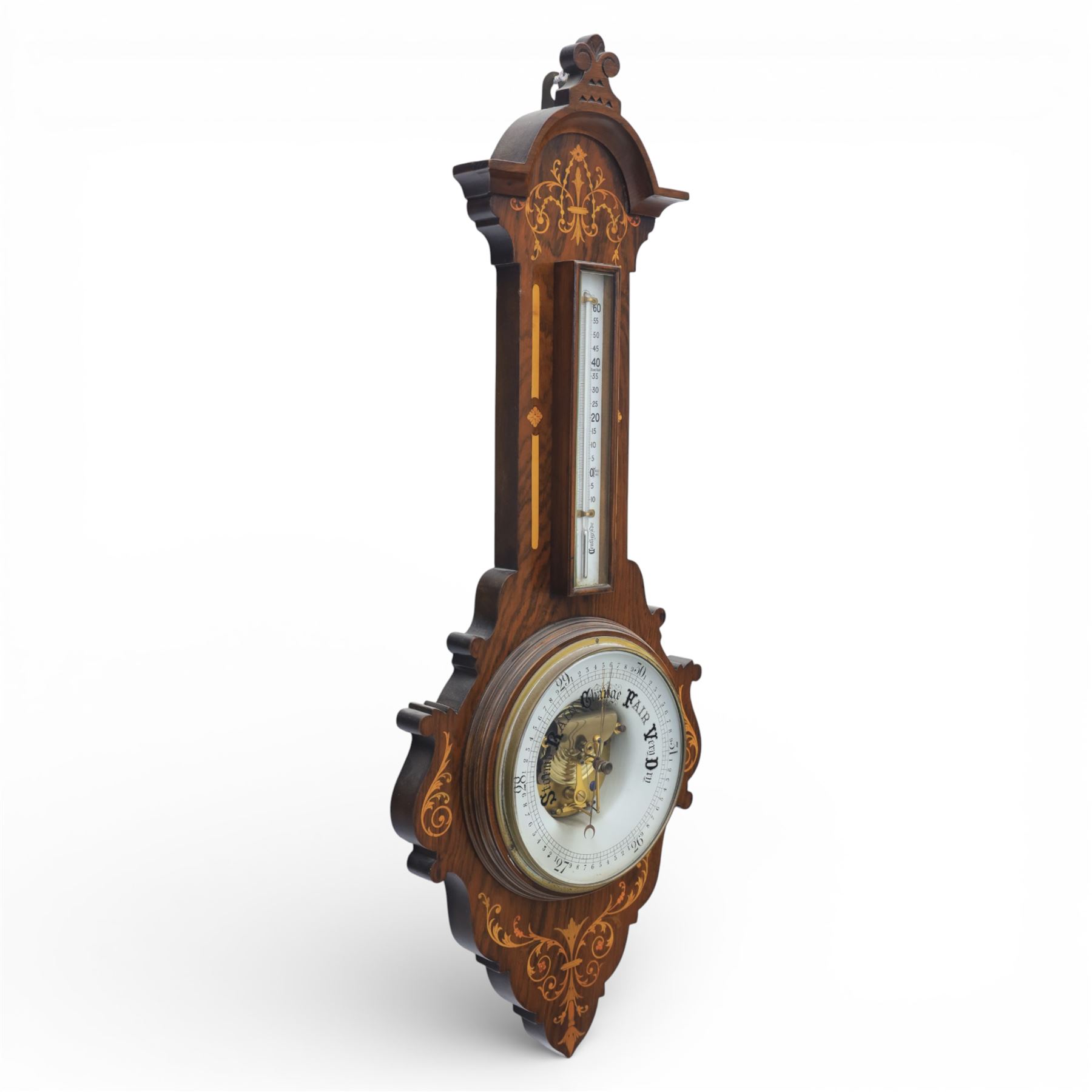 Victorian inlaid rosewood aneroid wall barometer, the circular glass-printed dial with brass bezel, with weather indications for Stormy, Rain, Change, Fair, and Very Dry, with enclosed aneroid movement beneath, shaped case with marquetry scrolls and foliate motifs surmounted by a thermometer with dual Fahrenheit and Centigrade scales, circa 1890-1900