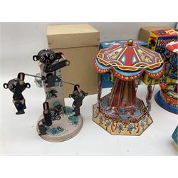 Mid 20th century and later tin plate clockwork toys, to include merry-go-rounds, spaceship carousel, walking robot, Schylling airport control tower, monkey riding horse, astronaut space station etc, including German and Japanese examples, some with boxes (12)