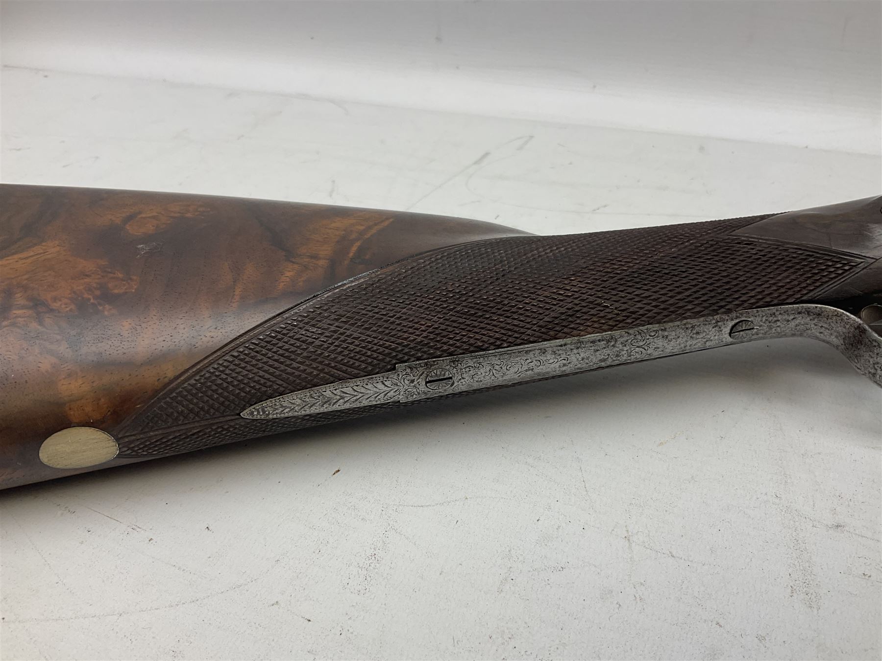 19th century John Jefferson of Scarborough 6-bore (modern 4-bore) double barrel side-by-side percussion gun, with 81cm stub twist damascus barrels (no provision for ramrod), well figured walnut stock with fine chequered grip and fore-end with horn tip and steel butt plate with long tang, well engraved lock and hammers with half-cock safeties on both sides, barrel sling swivel but rear sling swivel removed and replaced with silver escutcheon, London proofmarks, NVN, L128cm